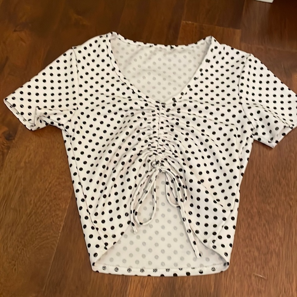 White with black polka dots top, ruching detail with a bow at the end.